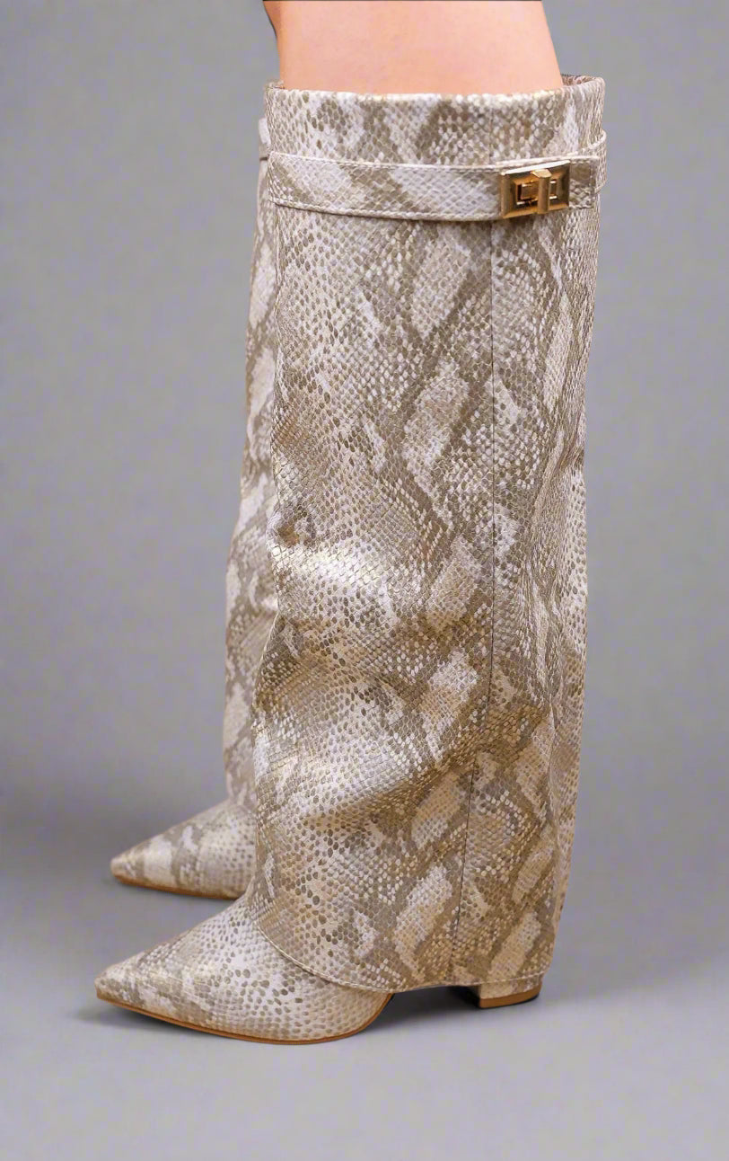 snake print knee-high boots on a beige background